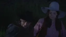 Heiße Cowgirl mit Hut kniet erregt zwischen zwei Cowboys am nächtlichen Lagerfeuer